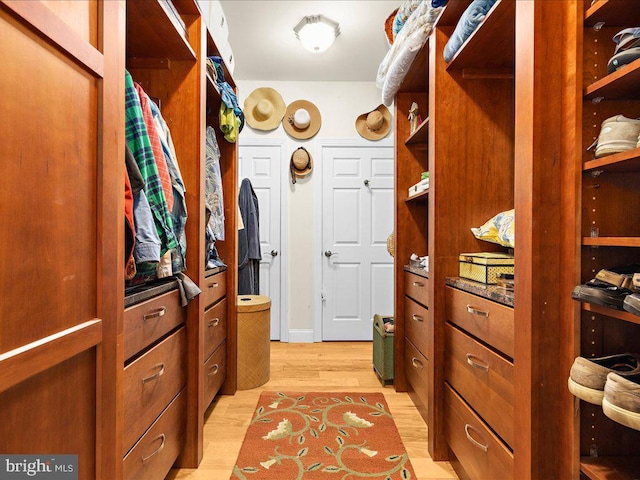 walk in closet featuring light wood-type flooring