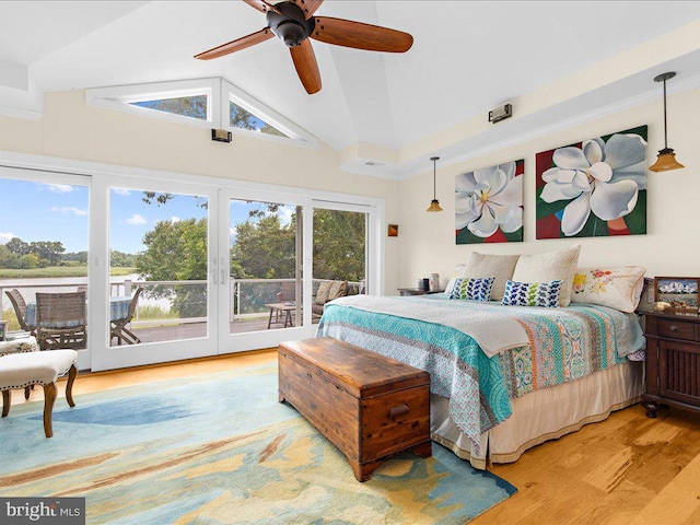 bedroom with access to outside, ceiling fan, lofted ceiling, and light wood-type flooring