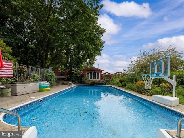 view of pool with a patio, a fenced in pool, and fence