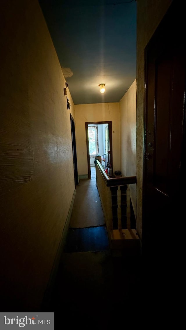 hallway featuring concrete flooring