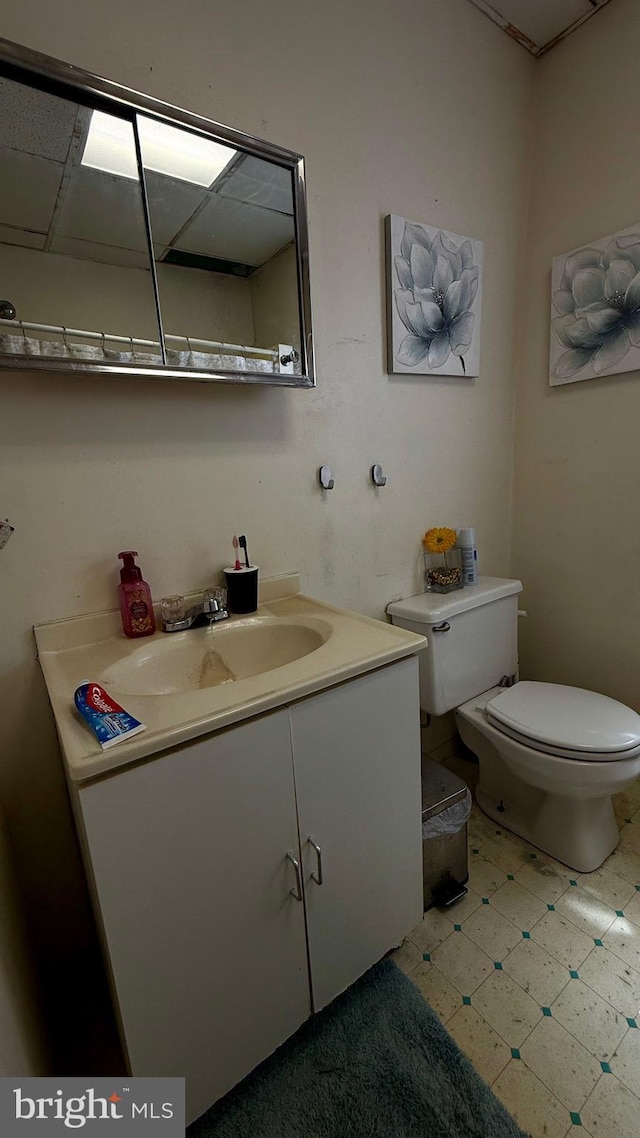 bathroom featuring toilet and vanity