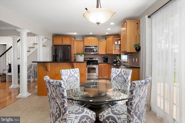 dining area featuring stairway, light tile patterned flooring, and recessed lighting