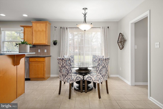 dining room with baseboards, recessed lighting, and light tile patterned floors