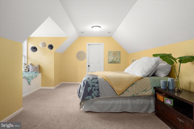 bedroom featuring carpet, visible vents, lofted ceiling, and baseboards