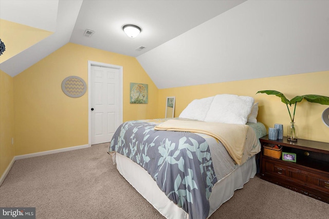 carpeted bedroom featuring baseboards, vaulted ceiling, and visible vents