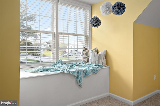 living area with a wealth of natural light and baseboards