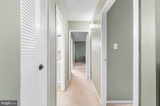 400 Glendale Rd Unit H-30, Havertown, PA 19083 - corridor featuring a textured ceiling and baseboards