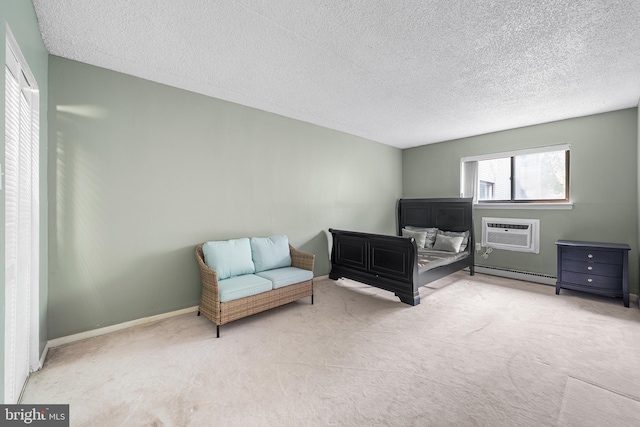 400 Glendale Rd Unit H-30, Havertown, PA 19083 - carpeted bedroom featuring a wall mounted AC, a baseboard heating unit, and a textured ceiling