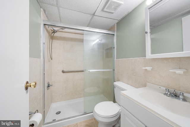 400 Glendale Rd Unit H-30, Havertown, PA 19083 - full bathroom featuring a shower stall, vanity, a paneled ceiling, tile walls, and wainscoting