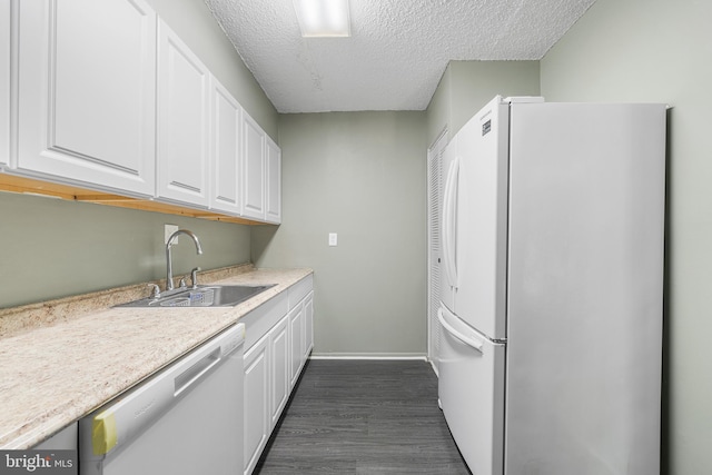 400 Glendale Rd Unit H-30, Havertown, PA 19083 - kitchen with freestanding refrigerator, dishwashing machine, white cabinetry, light countertops, and a textured ceiling