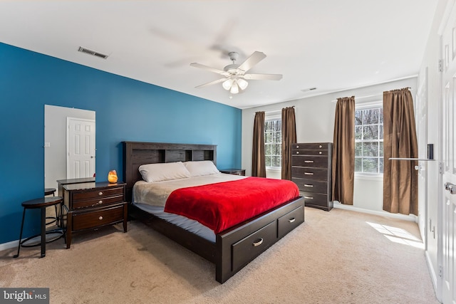 bedroom featuring baseboards, visible vents, carpet flooring, and a ceiling fan