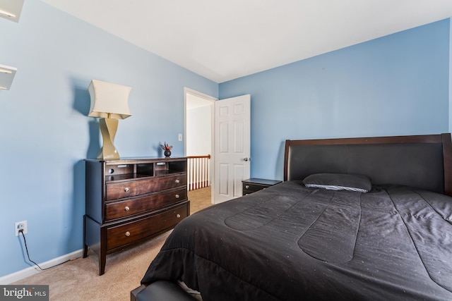 bedroom featuring baseboards and carpet floors