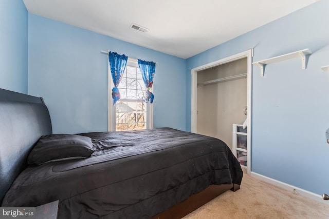 carpeted bedroom featuring baseboards and visible vents
