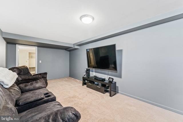 carpeted living room featuring baseboards