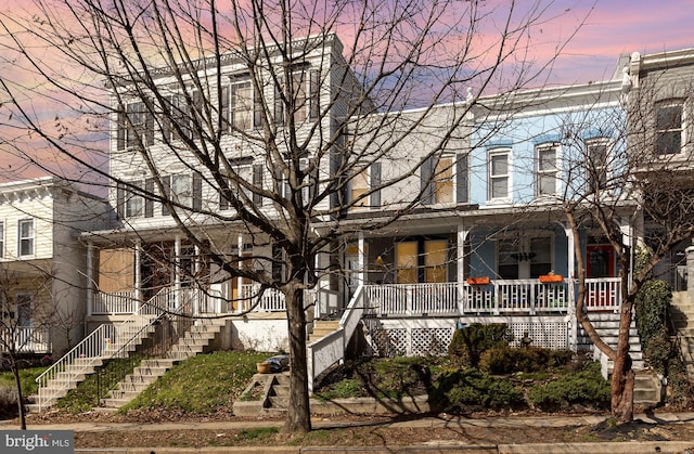 3524 Hickory Ave, Baltimore, MD 21211 - townhome / multi-family property featuring covered porch and stairway