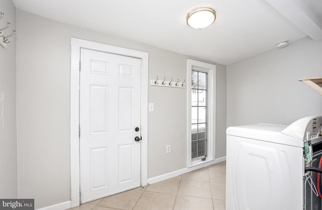 3524 Hickory Ave, Baltimore, MD 21211 - clothes washing area with baseboards, washer / clothes dryer, laundry area, and light tile patterned floors