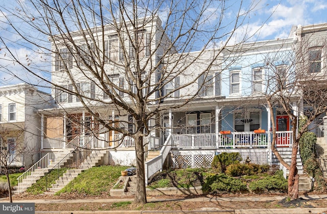 3524 Hickory Ave, Baltimore, MD 21211 - townhome / multi-family property featuring stairway and a porch