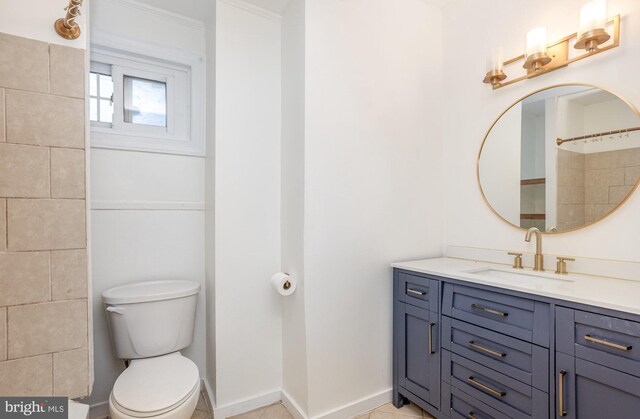 3524 Hickory Ave, Baltimore, MD 21211 - full bathroom with baseboards, toilet, tile patterned flooring, and vanity