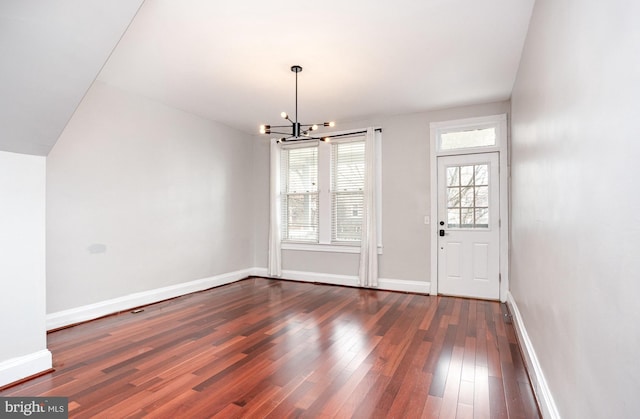 3524 Hickory Ave, Baltimore, MD 21211 - entryway featuring dark wood-type flooring, baseboards, and a notable chandelier