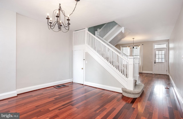 3524 Hickory Ave, Baltimore, MD 21211 - foyer entrance with stairway, wood-type flooring, baseboards, visible vents, and an inviting chandelier