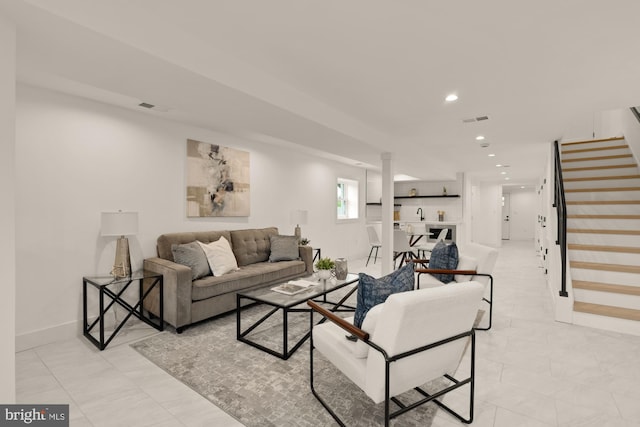 living area with stairs, recessed lighting, and baseboards