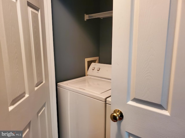 washroom featuring independent washer and dryer and laundry area