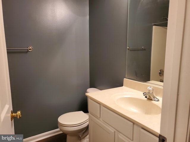 bathroom with toilet and vanity