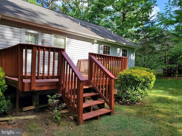 wooden terrace with a lawn