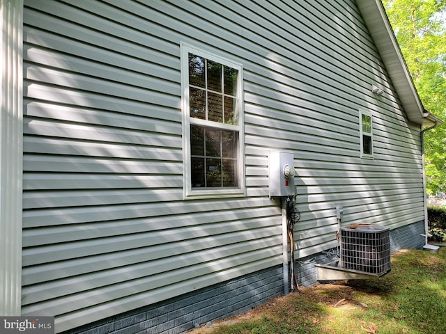 view of property exterior with central AC unit