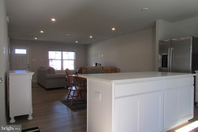 30155 Creekview Cir, Selbyville, DE 19975 - kitchen with open floor plan, light countertops, recessed lighting, white cabinets, and wood finished floors