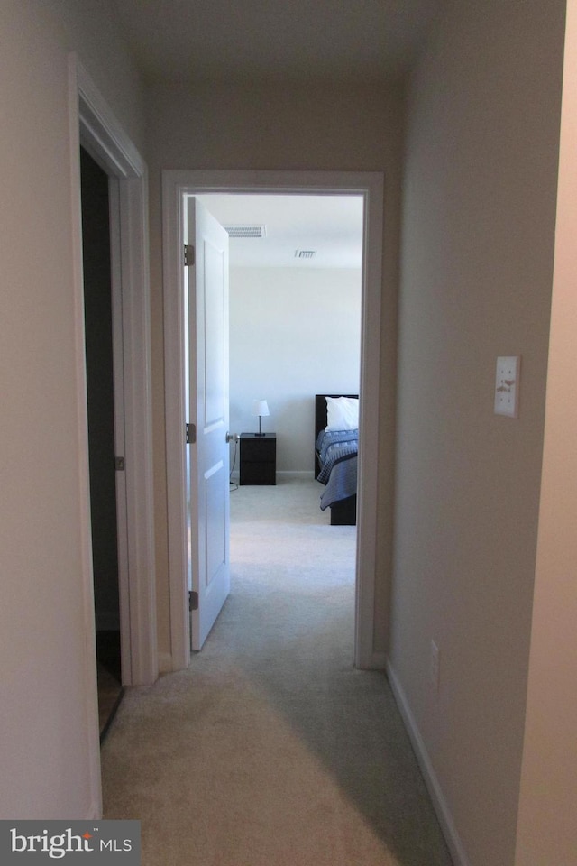 30155 Creekview Cir, Selbyville, DE 19975 - hallway with baseboards, visible vents, and carpet