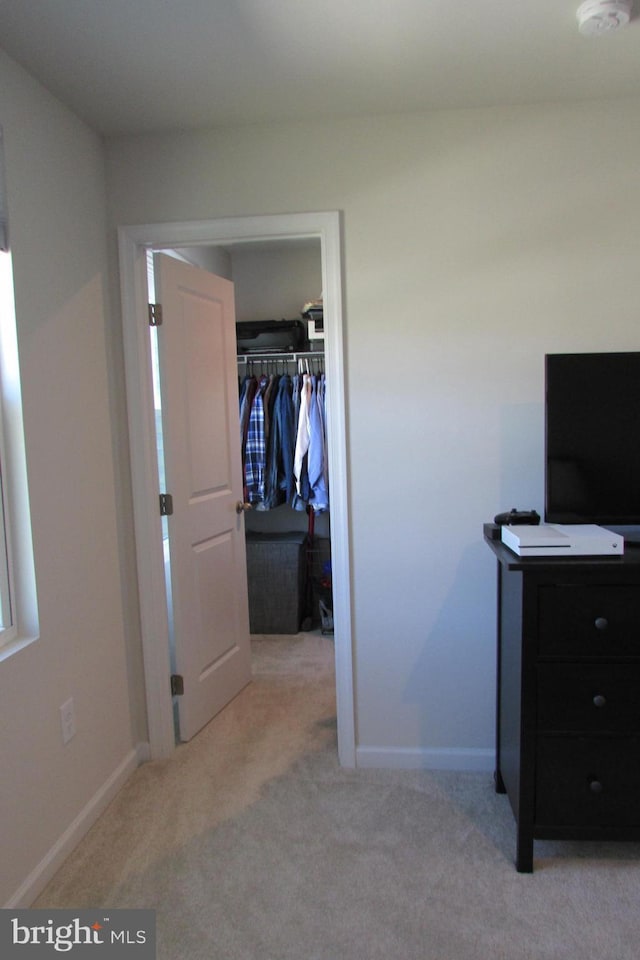 30155 Creekview Cir, Selbyville, DE 19975 - unfurnished bedroom with a closet, baseboards, a walk in closet, and carpet