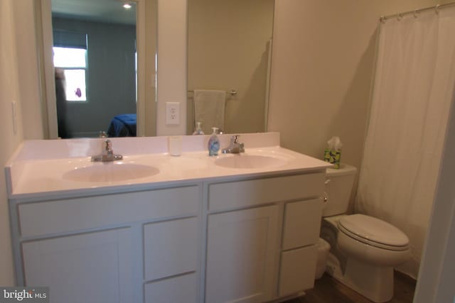 30155 Creekview Cir, Selbyville, DE 19975 - bathroom featuring double vanity, a sink, toilet, and ensuite bathroom
