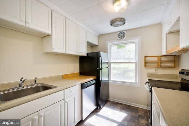 50 Ridge Rd, Greenbelt, MD 20770 - kitchen with a sink, white cabinetry, baseboards, and appliances with stainless steel finishes