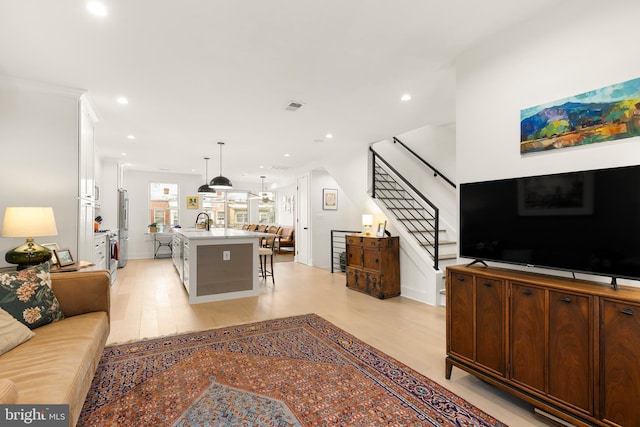 632 Rock Creek Church Rd NW Unit 2, Washington, DC 20010 - living room with stairs, light wood-type flooring, and recessed lighting
