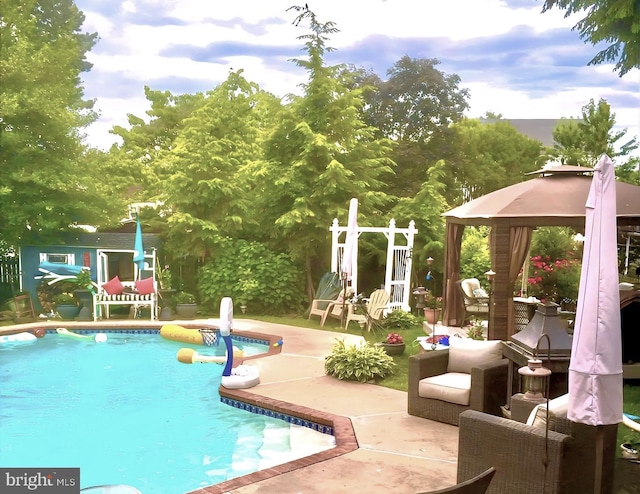 outdoor pool featuring a gazebo and a patio area