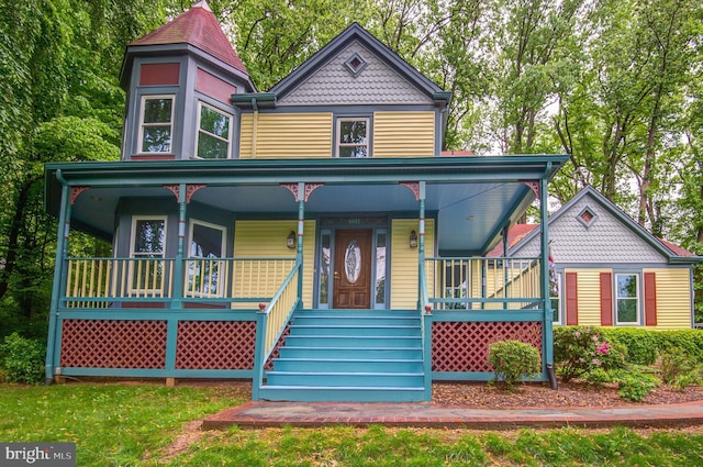 victorian-style house with a porch