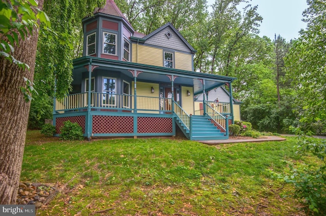 victorian home featuring a porch and a front yard