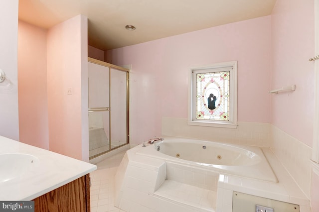 full bath featuring a shower stall, a tub with jets, and vanity