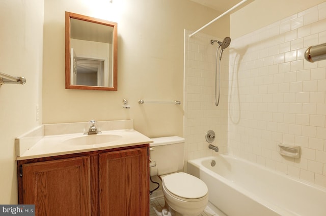 bathroom with toilet, vanity, and shower / bathtub combination