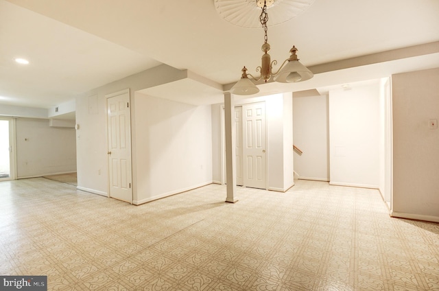 finished below grade area with baseboards, stairway, and recessed lighting