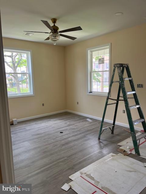 628 W 2nd St, Florence, NJ 08518 - spare room featuring plenty of natural light, ceiling fan, and wood finished floors