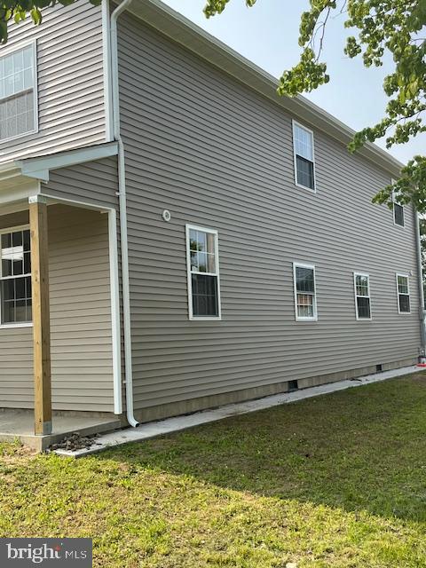 628 W 2nd St, Florence, NJ 08518 - view of property exterior with a lawn and crawl space