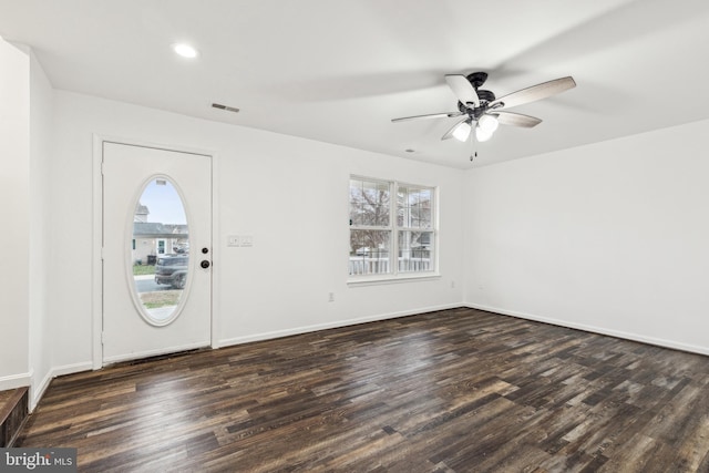 foyer entrance with dark wood-style floors, a healthy amount of sunlight, and ceiling fan