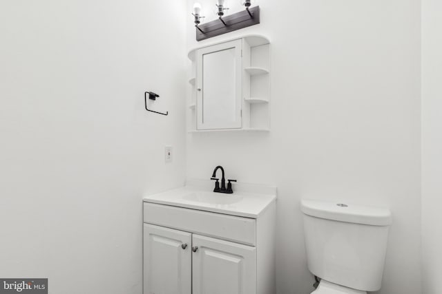 bathroom with toilet and vanity