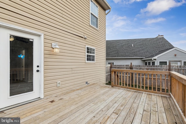 wooden terrace featuring fence