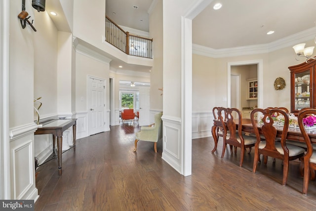 2042 Drovers Ln, Cooksville, MD 21723 - dining area featuring ornamental molding, a decorative wall, a wainscoted wall, dark wood-style floors, and decorative columns