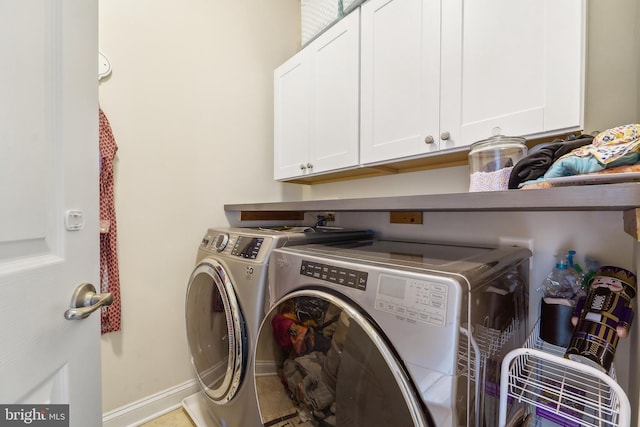 2042 Drovers Ln, Cooksville, MD 21723 - laundry area featuring washing machine and clothes dryer, cabinet space, and baseboards