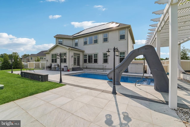 2042 Drovers Ln, Cooksville, MD 21723 - view of swimming pool featuring a water slide, entry steps, and a patio area