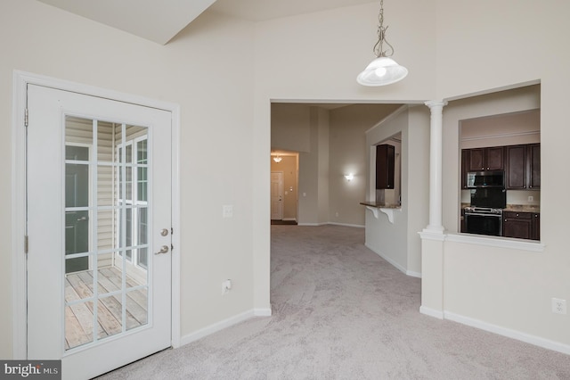 5207 Wyndholme Cir Unit 402, Baltimore, MD 21229 - unfurnished room with light carpet, baseboards, and ornate columns
